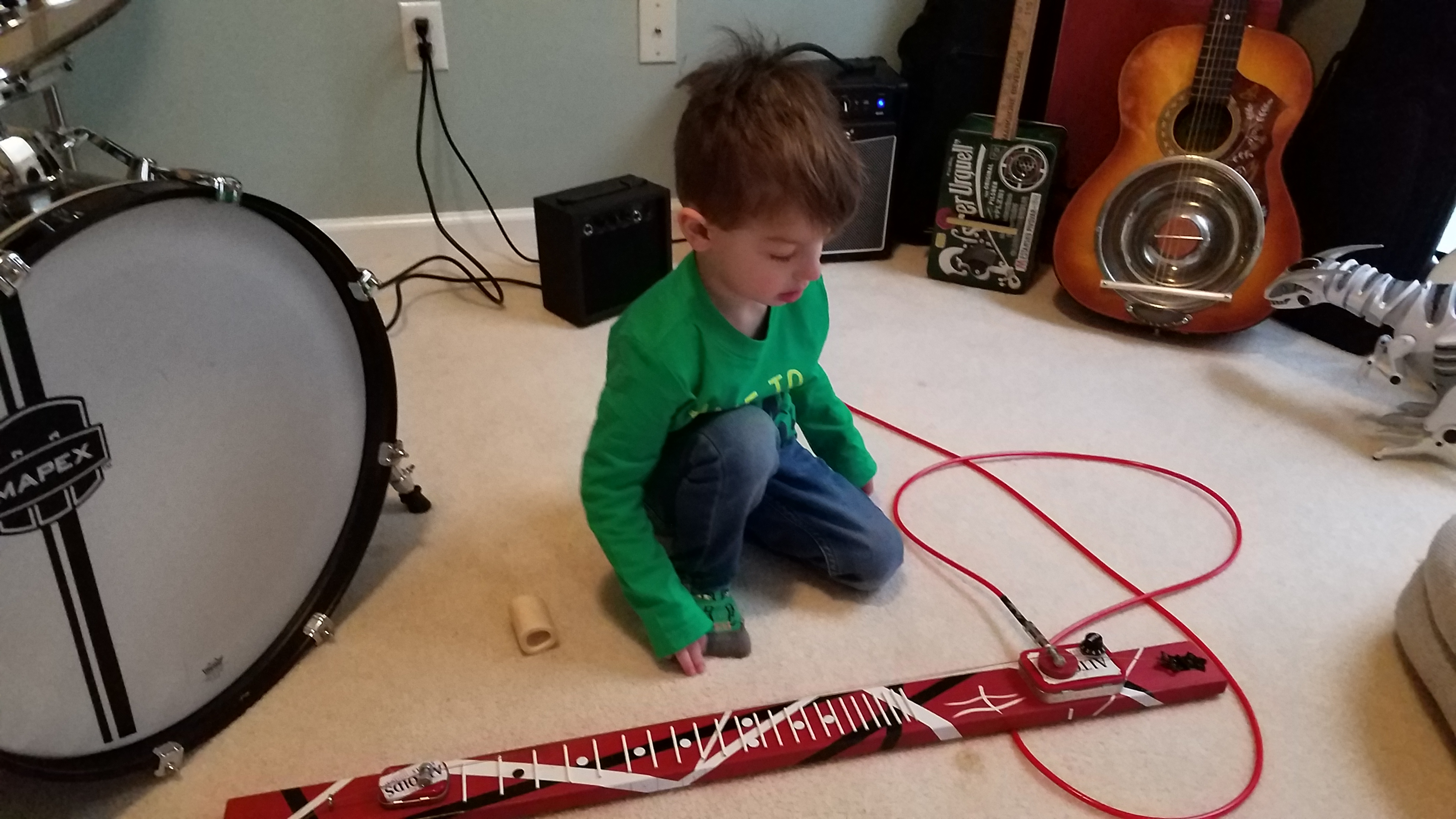 You can see the fret wire and fret markers as my grandson plays it