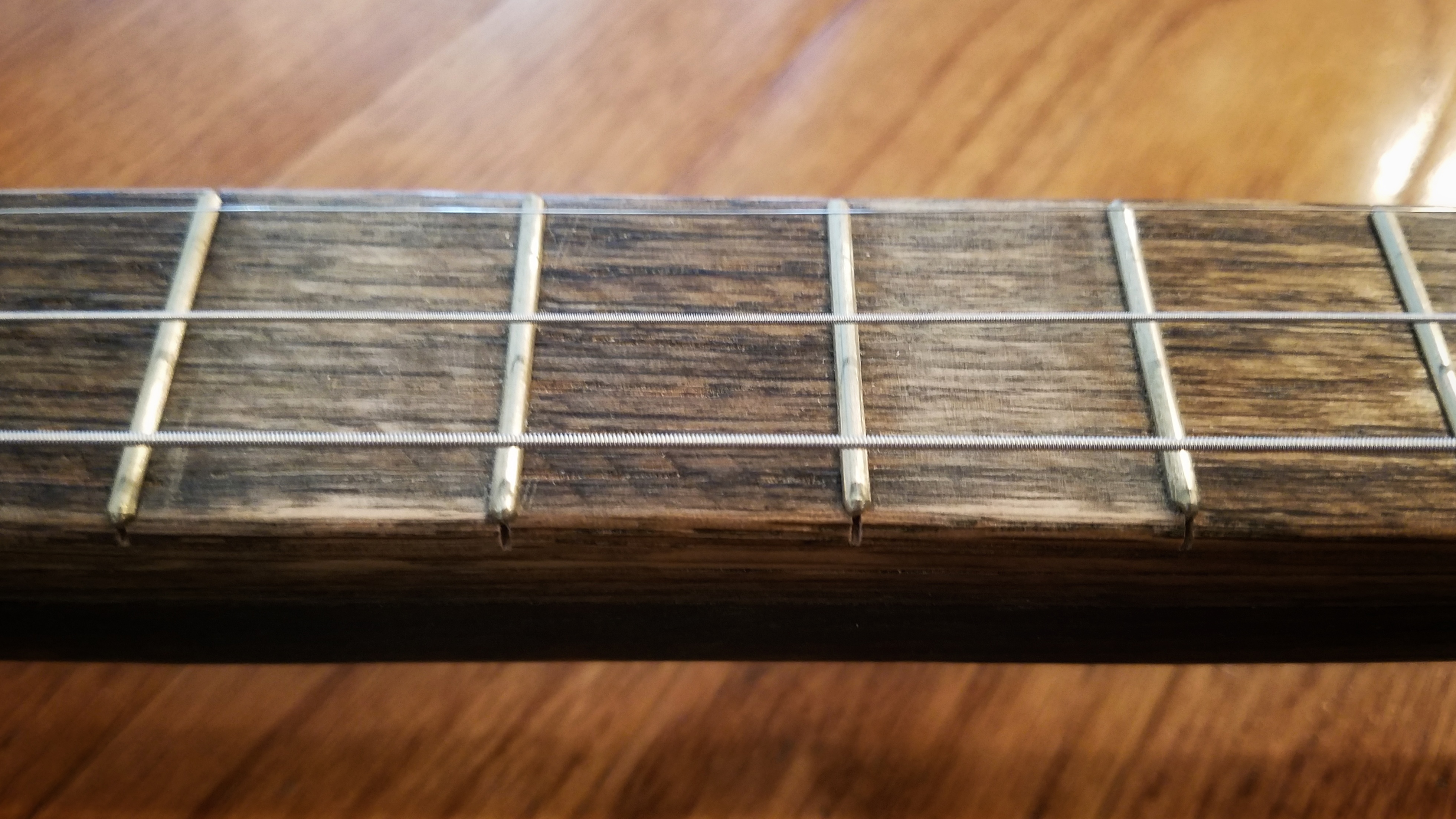 Instead of fret markers, I sanded away some of the stain