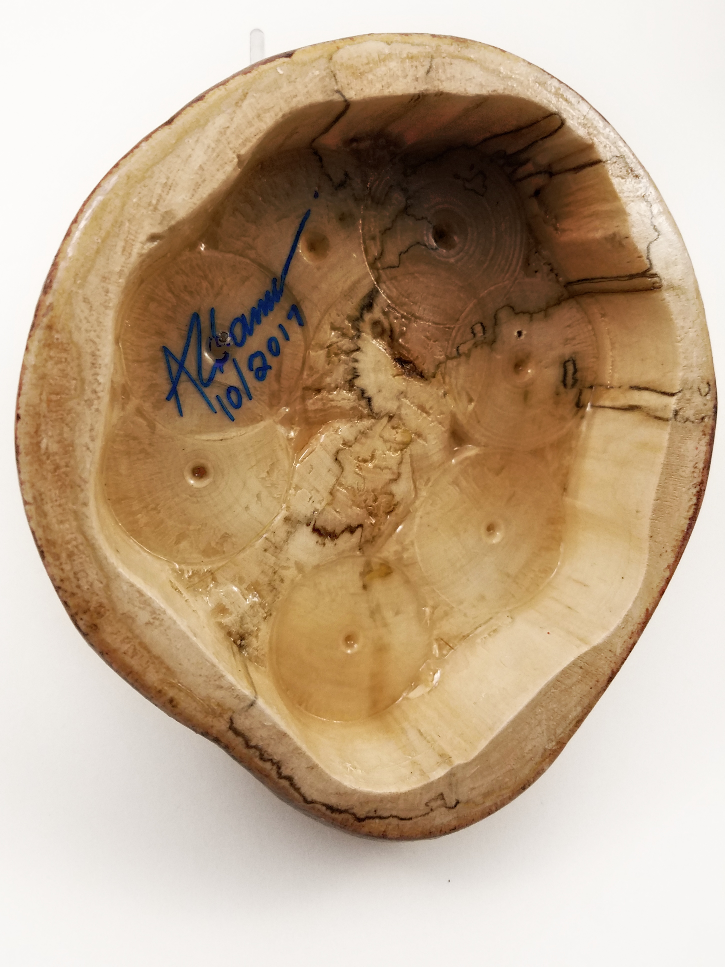 Hollowed out to get more resonance when placed on a flat surface