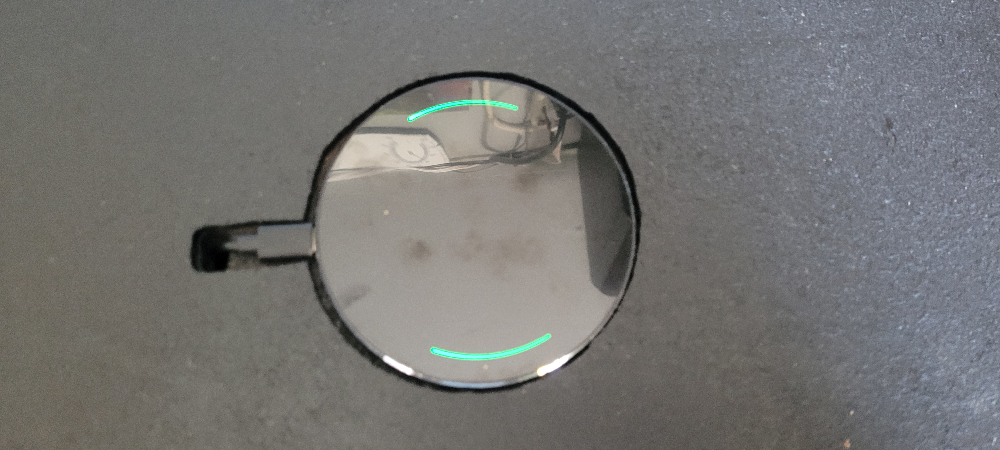 Wireless phone charger recessed into the lid