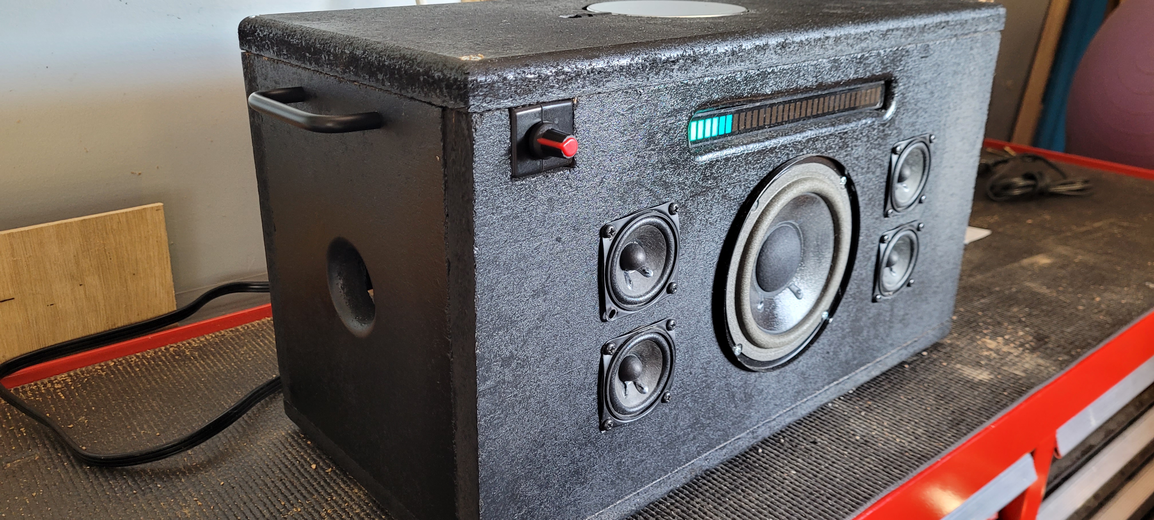 Added a sound hole on the side and handles for carrying it around