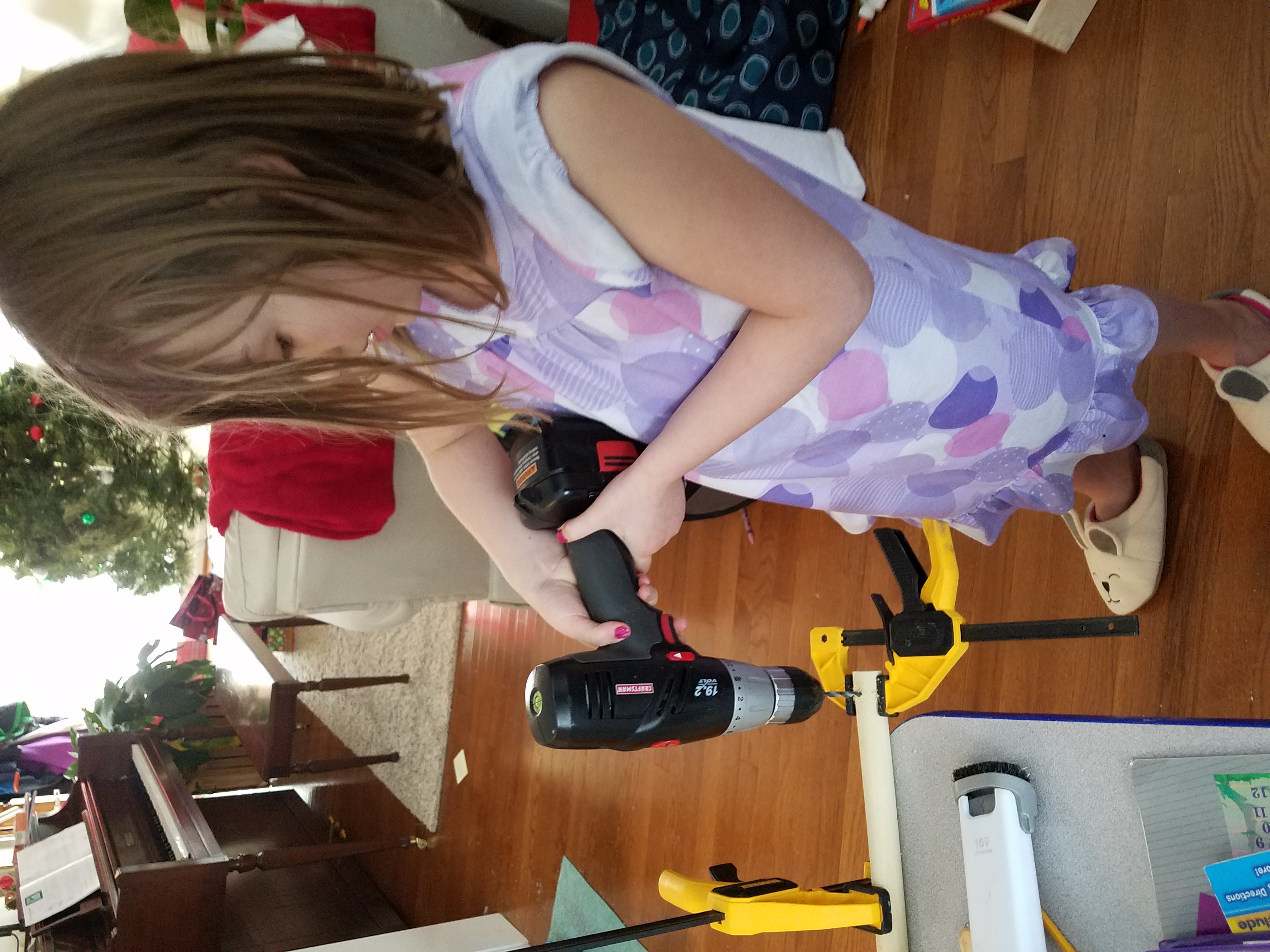 Drilling the hole to hold the string