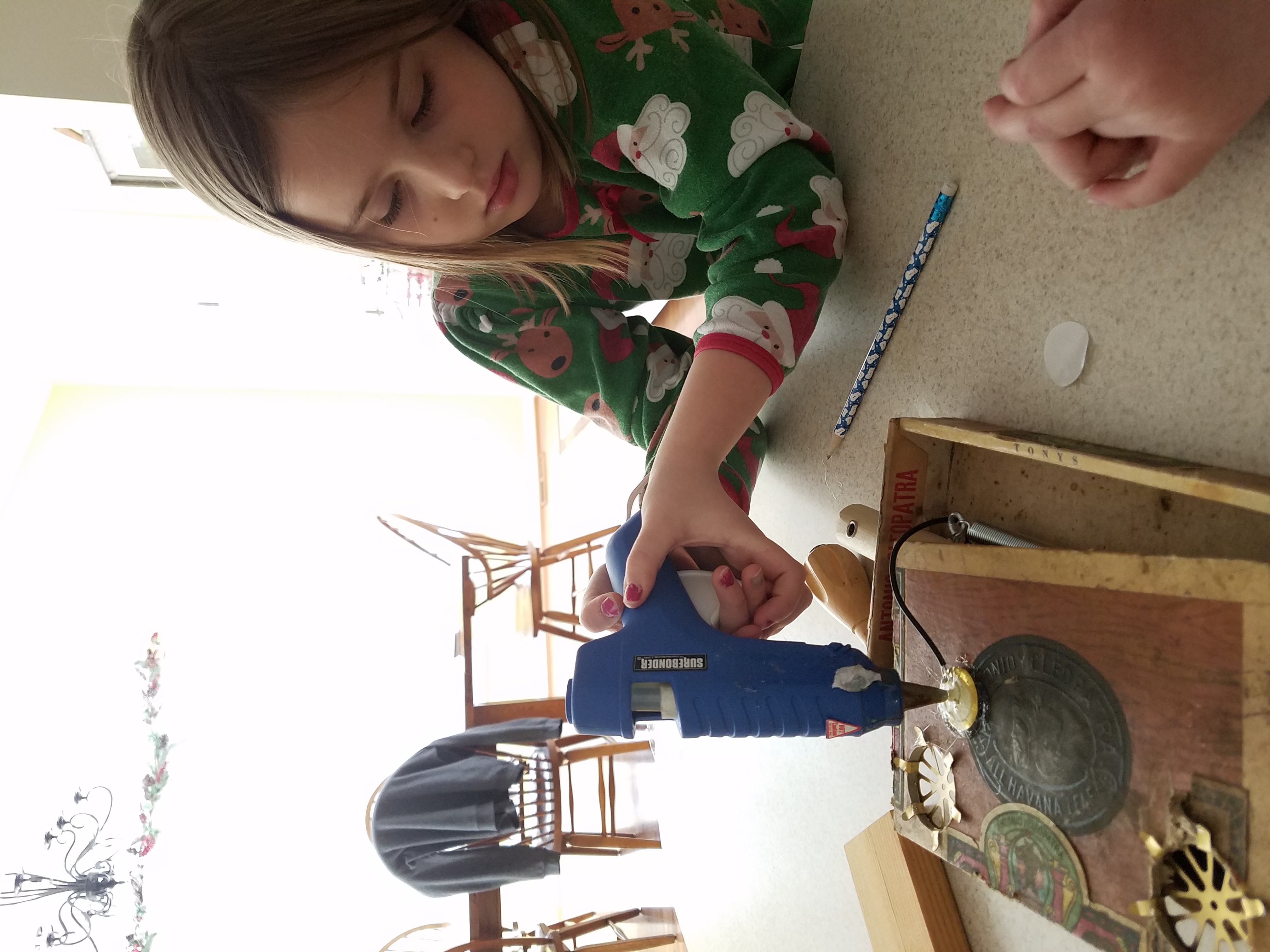 Hot gluing the piezo (contact mic) to the lid