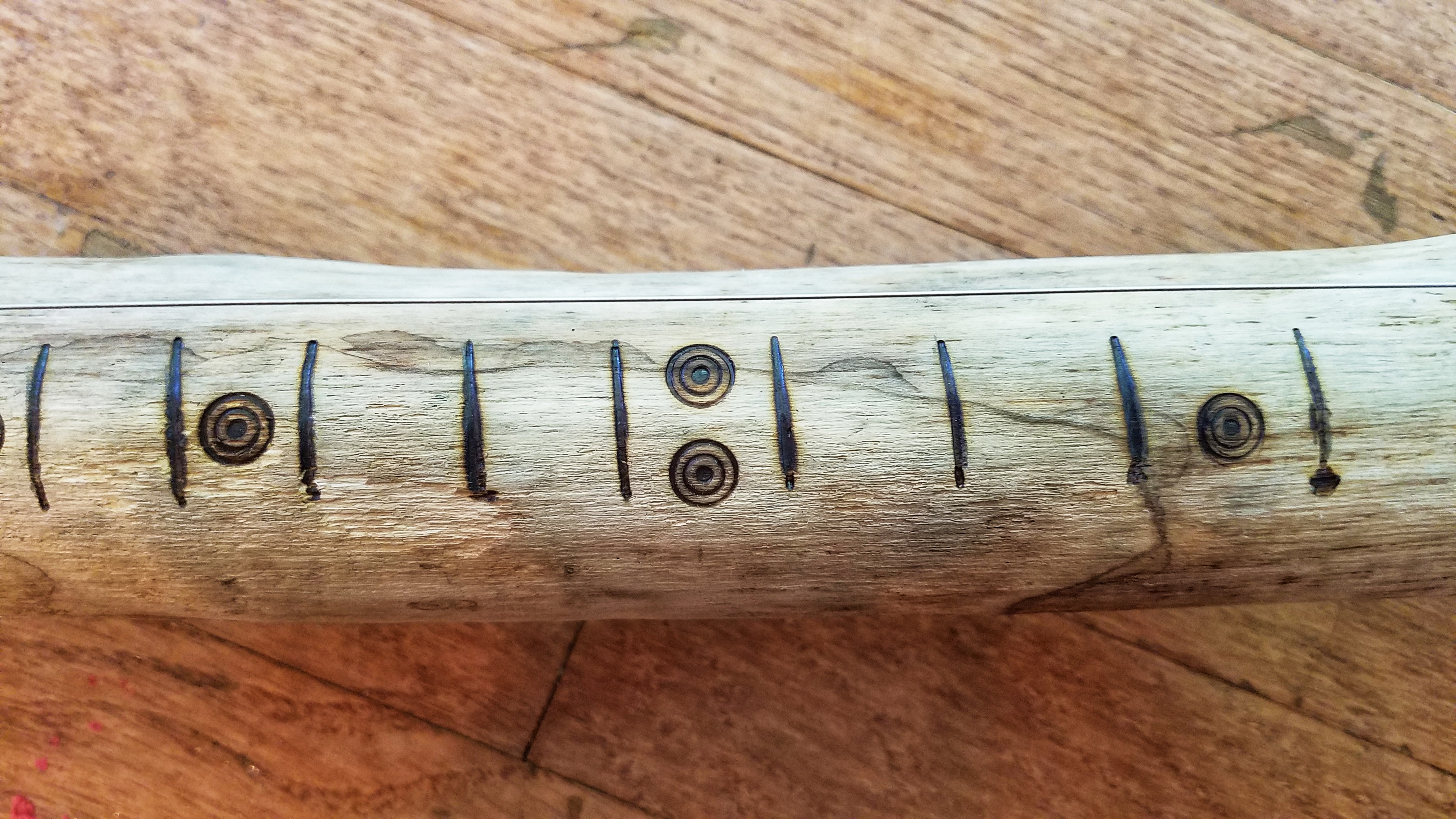 Woodburned fret markers