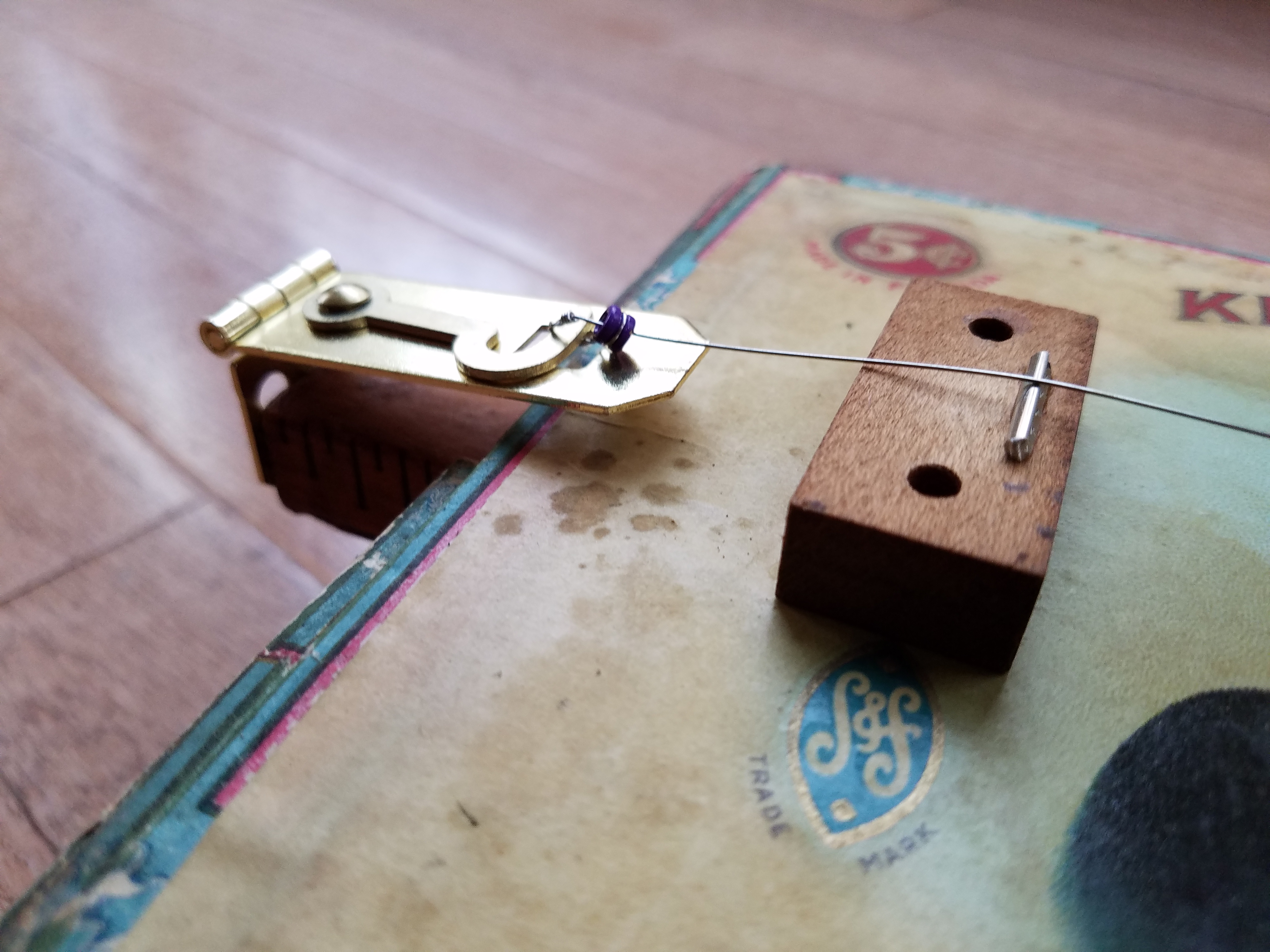 Scrap wood and fret wire make the bridge