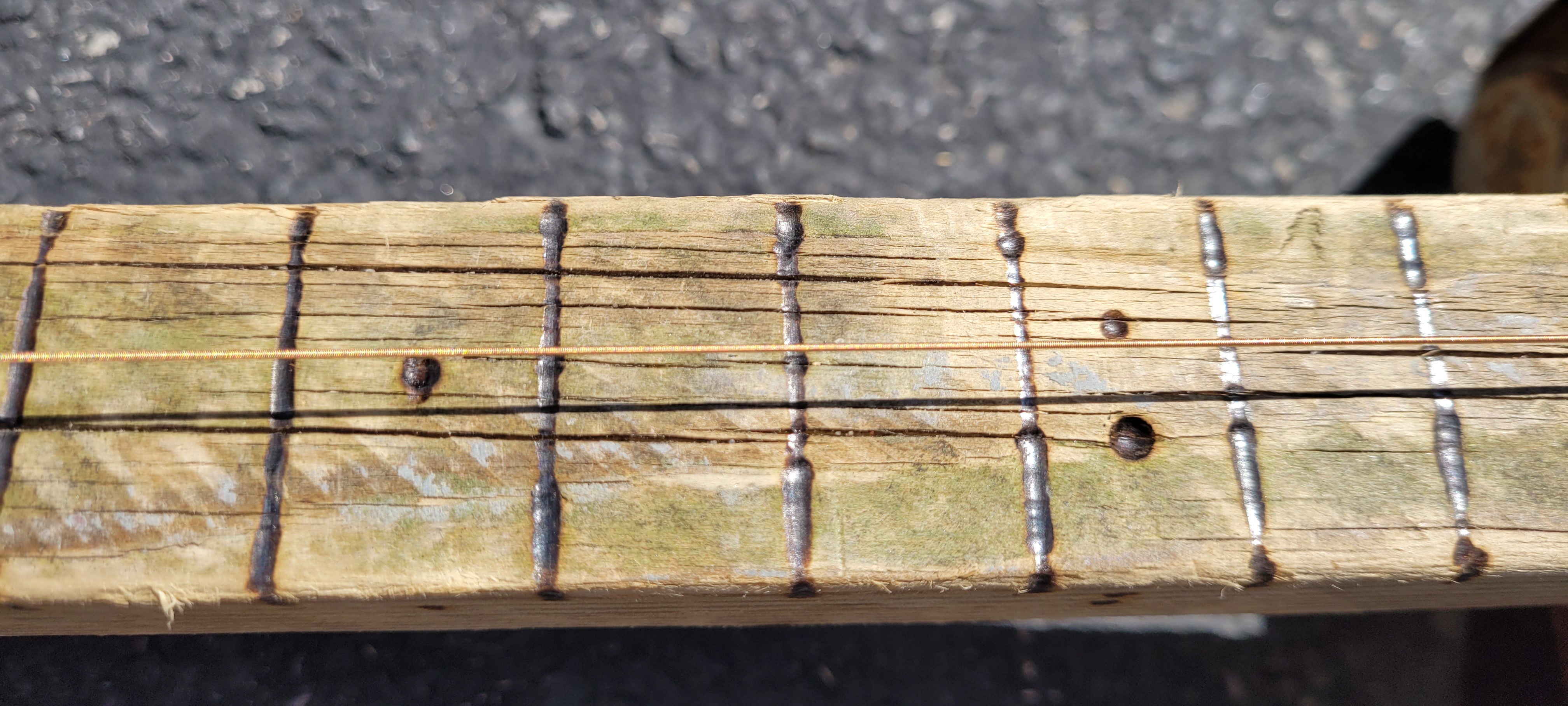 Wood burned the fret markers
