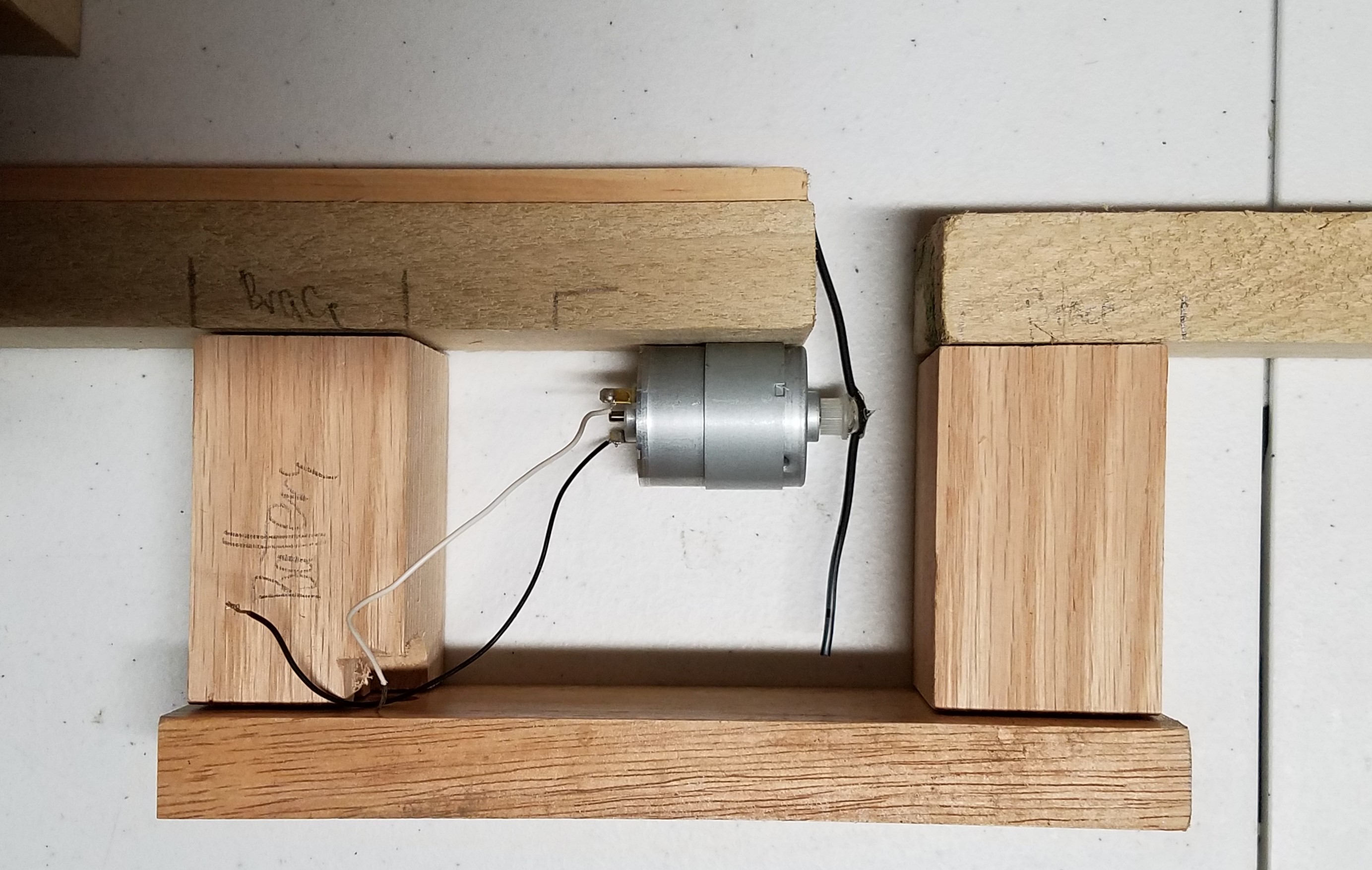 Motor with wires to strike the string