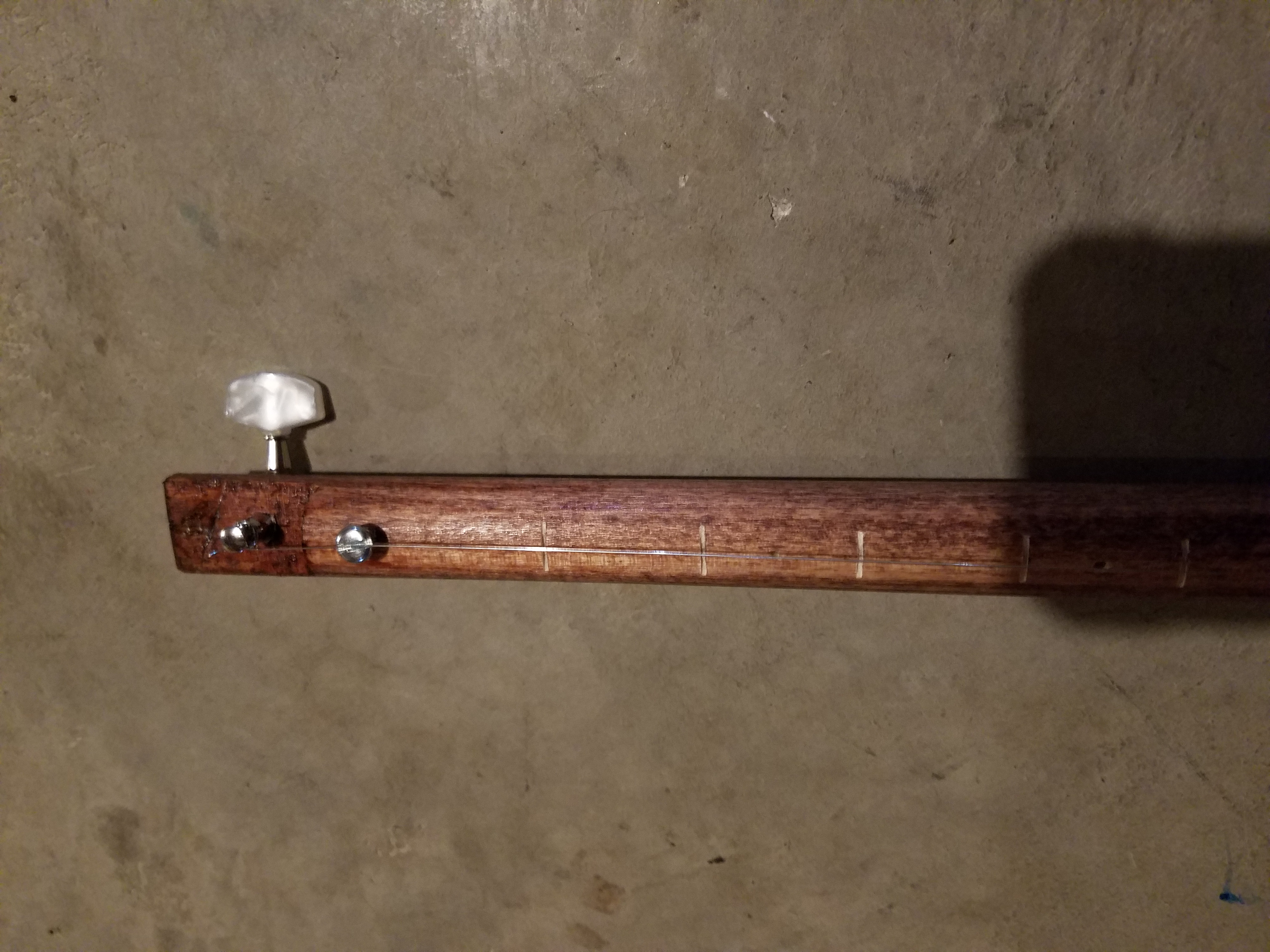 Fret lines are cut into the dowel