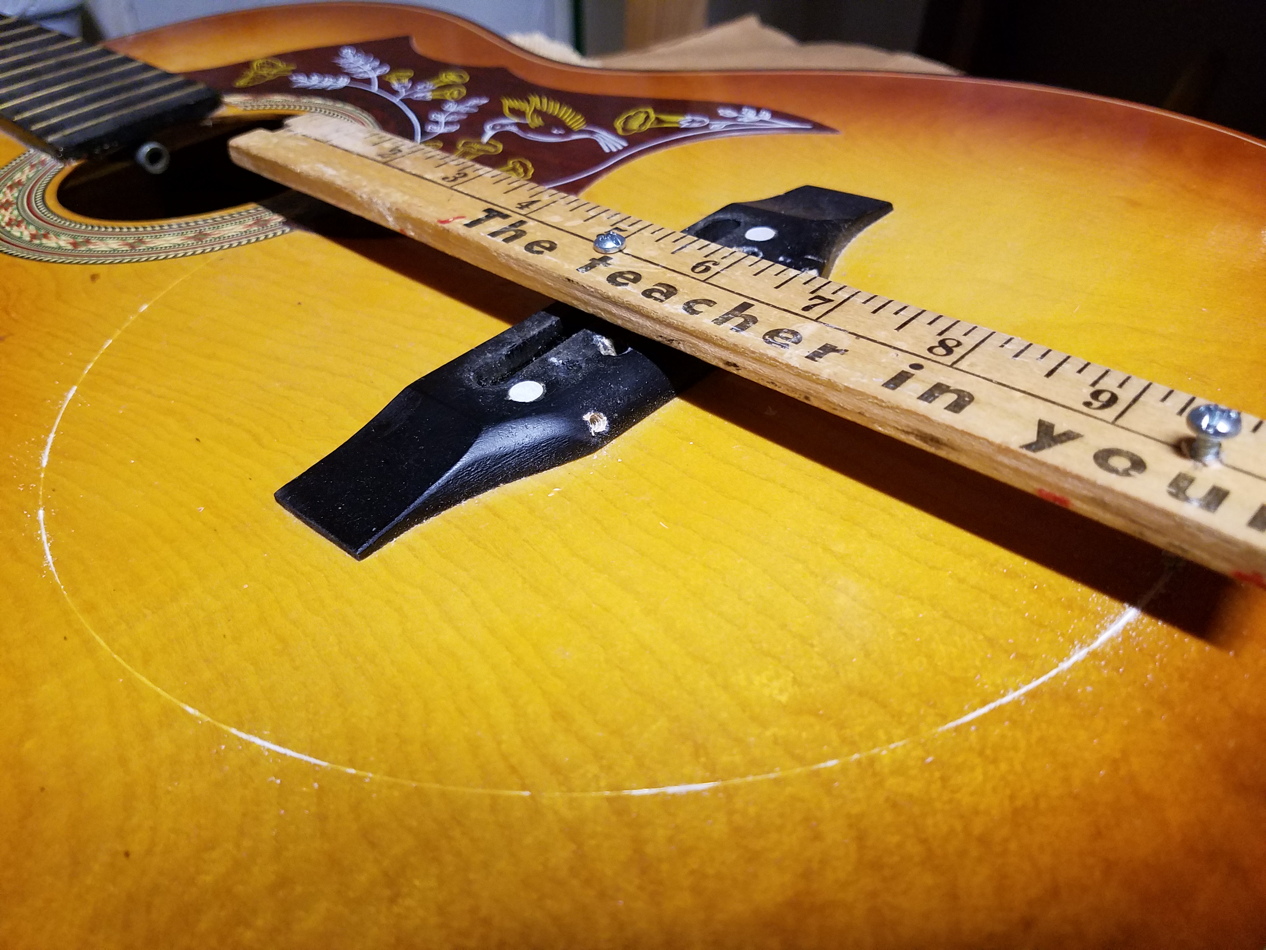 Here’s a way to draw a circle without a compass…drive two screws or nails into a yard stick, then use one to scratch the circle you want.