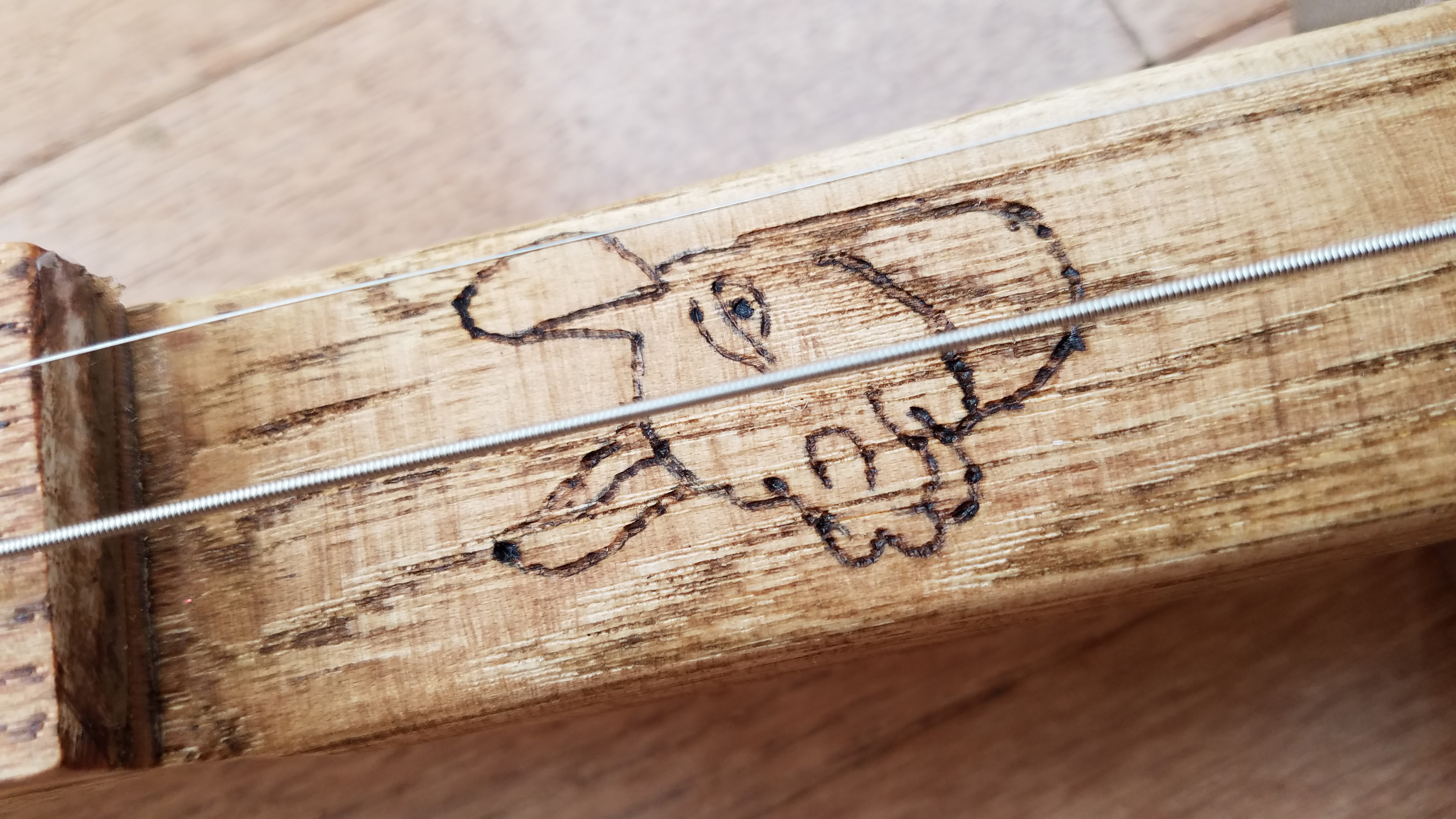 Woodburned logo