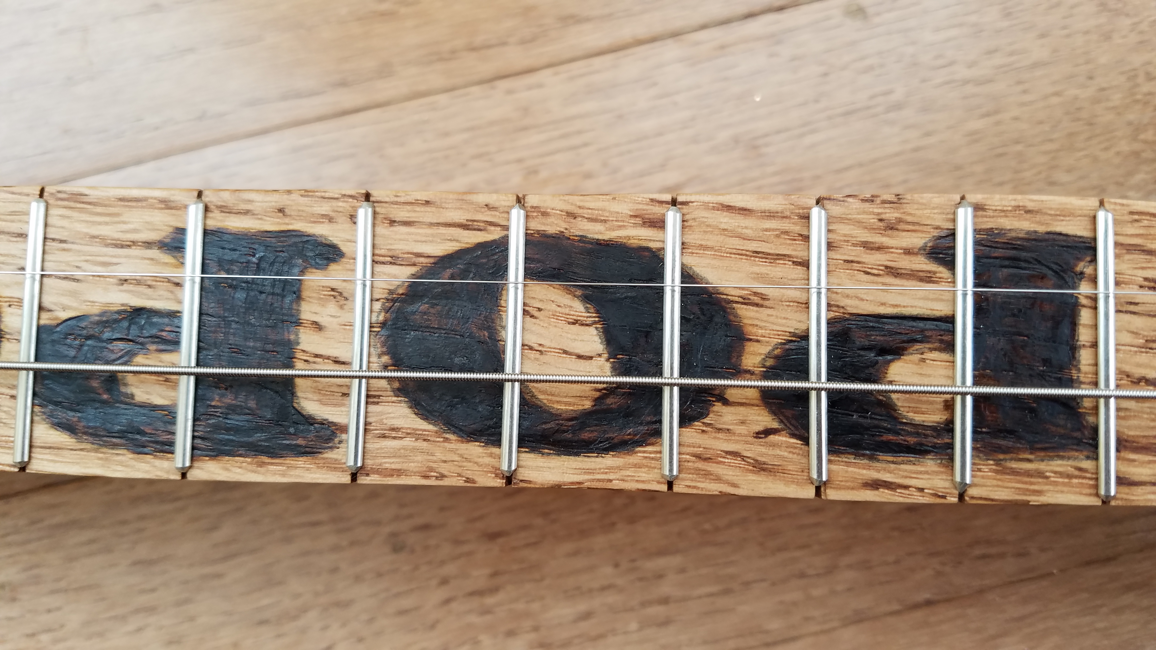 Woodburned the word POPCORN!