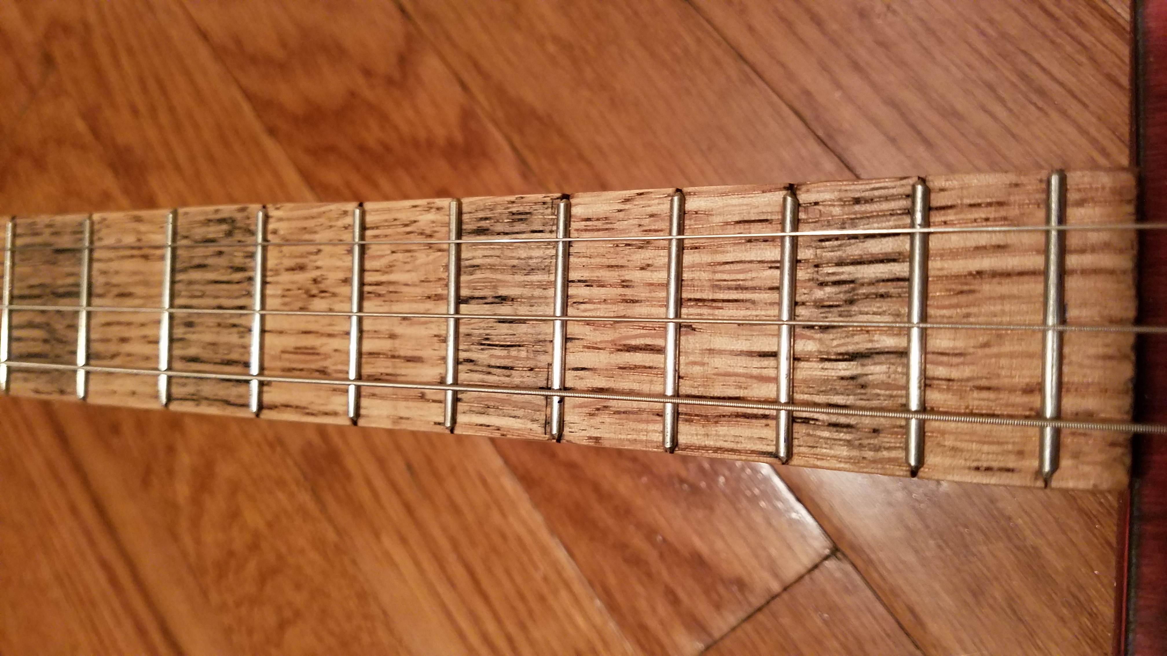Slightly heavier stain applied instead of fret markers
