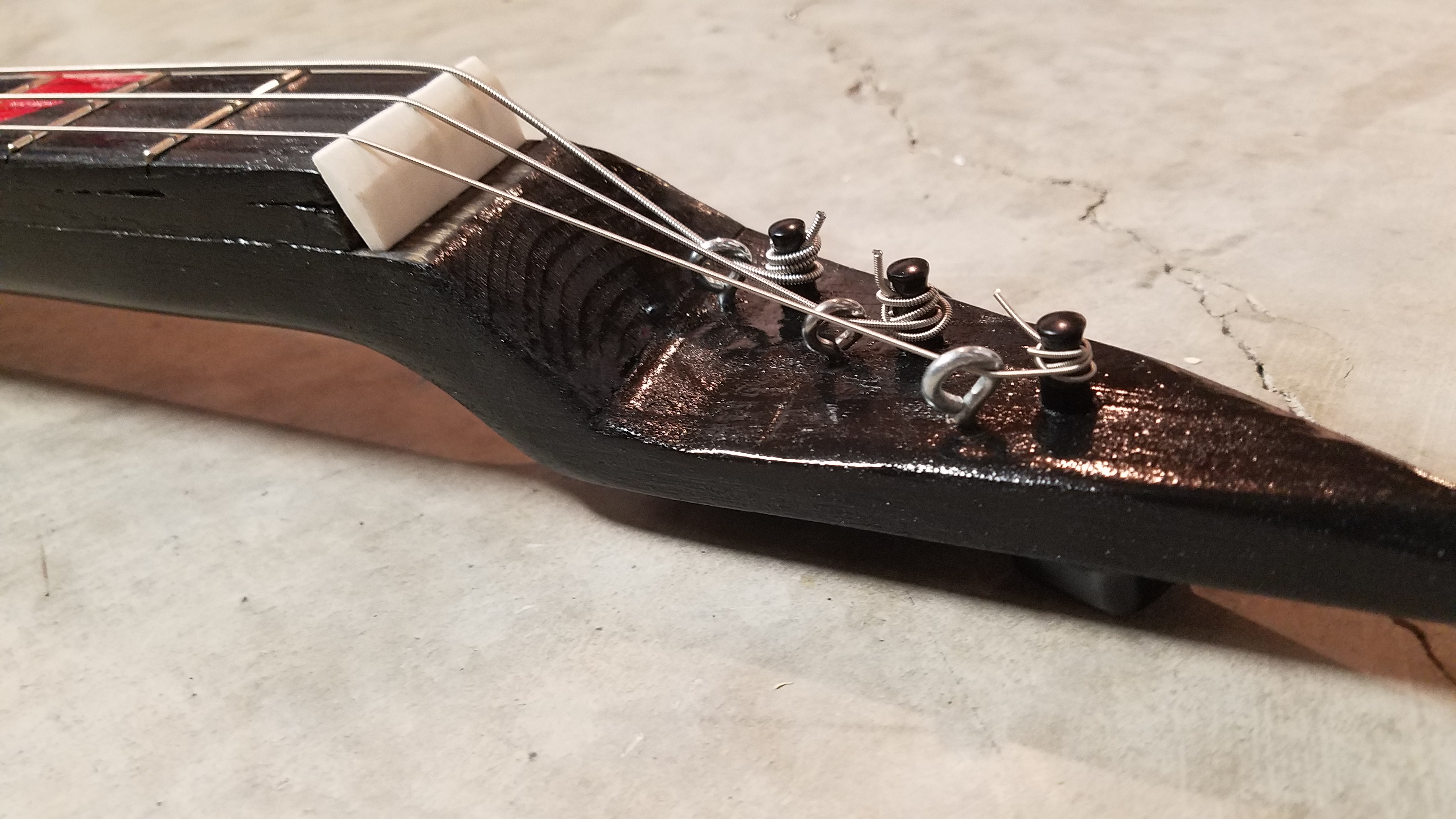 In hindsight the string angle here is too steep. You can see the low string doesn’t want to bend that much