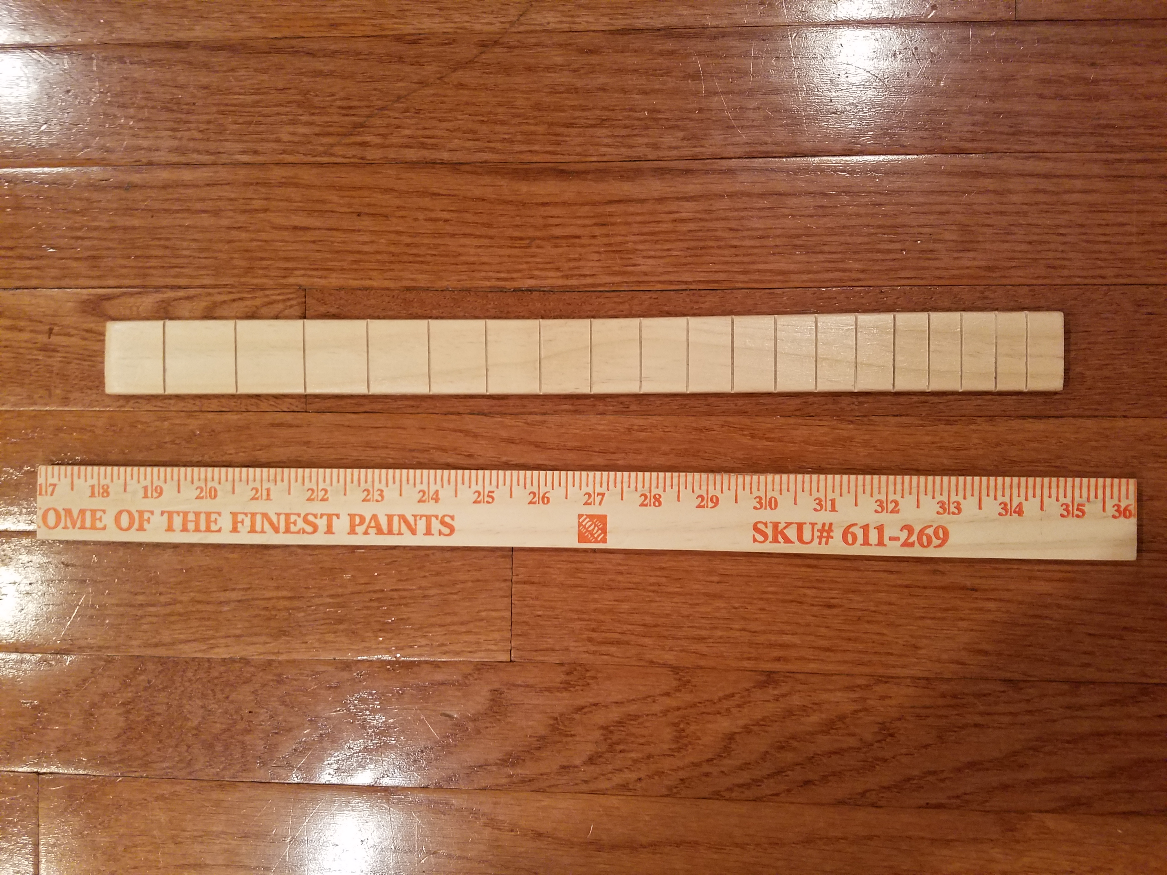 The fretboard is a yardstick with all the numbers and markings sanded off. This took FOREEEEEEVER…