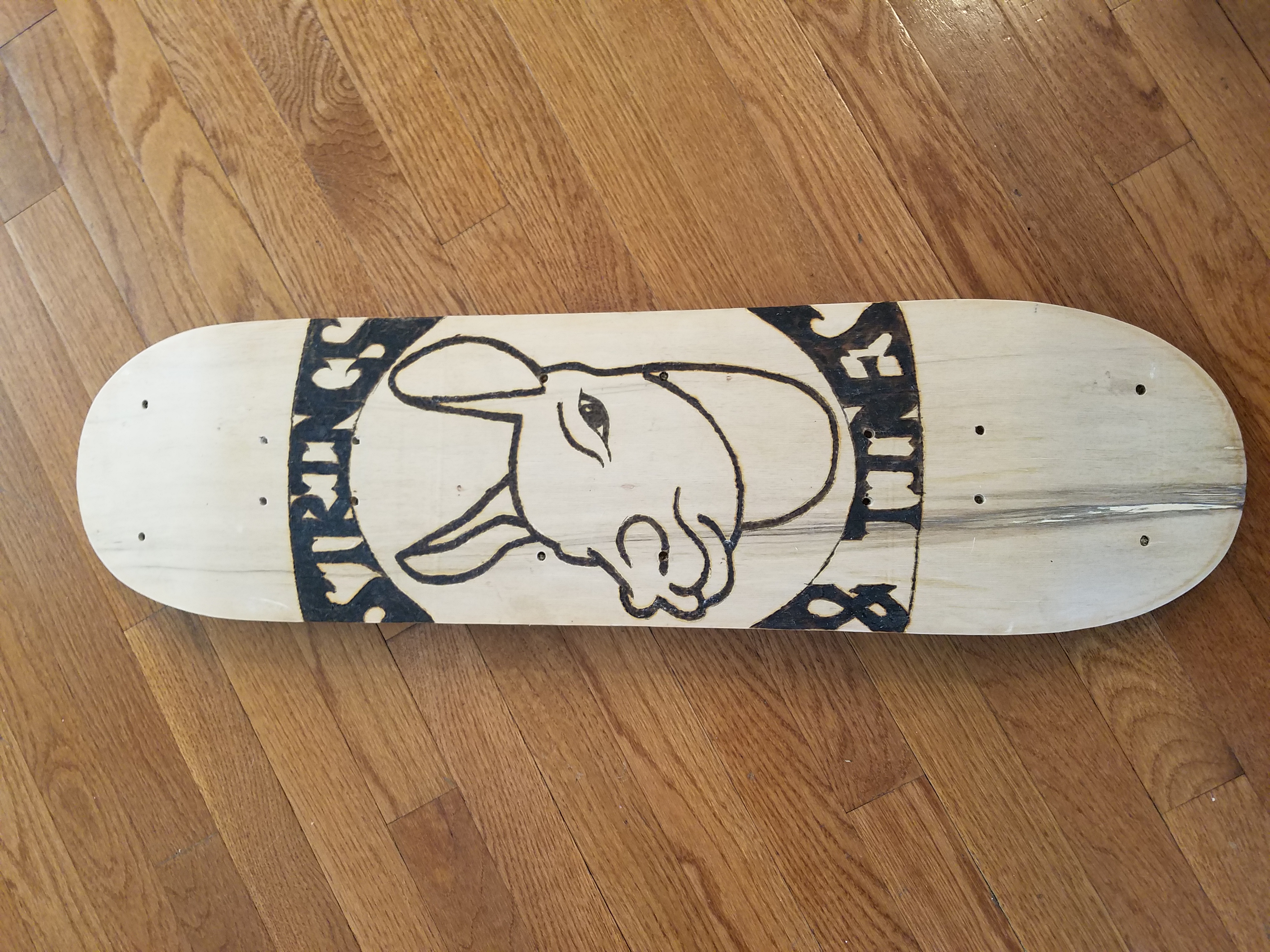 Strings and Tines skateboard